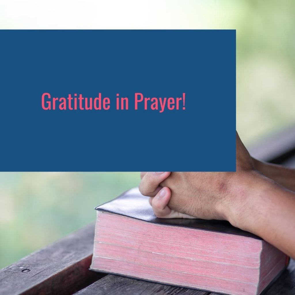 Hands clasped in prayer resting on a Bible, representing "Gratitude in Every Season" as a devotional practice for growing closer to God through thankful prayer.