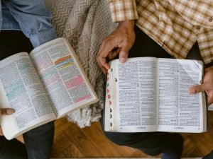 Two people studying the Bible – Following Jesus for Beginners.